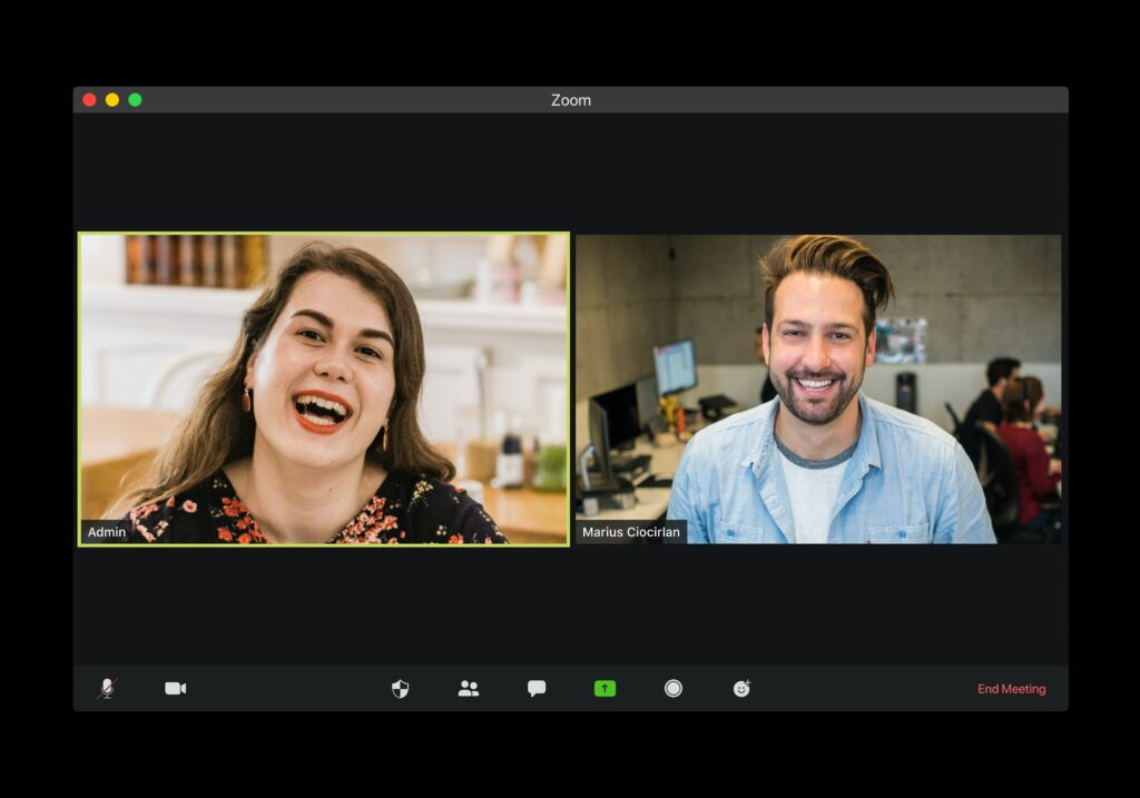Screenshot of video call with two participants smiling