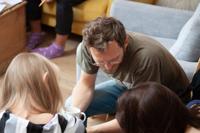 Photo of three people talking