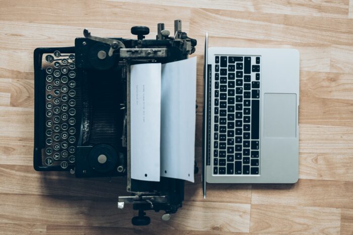 Typewriter and computer next to each other
